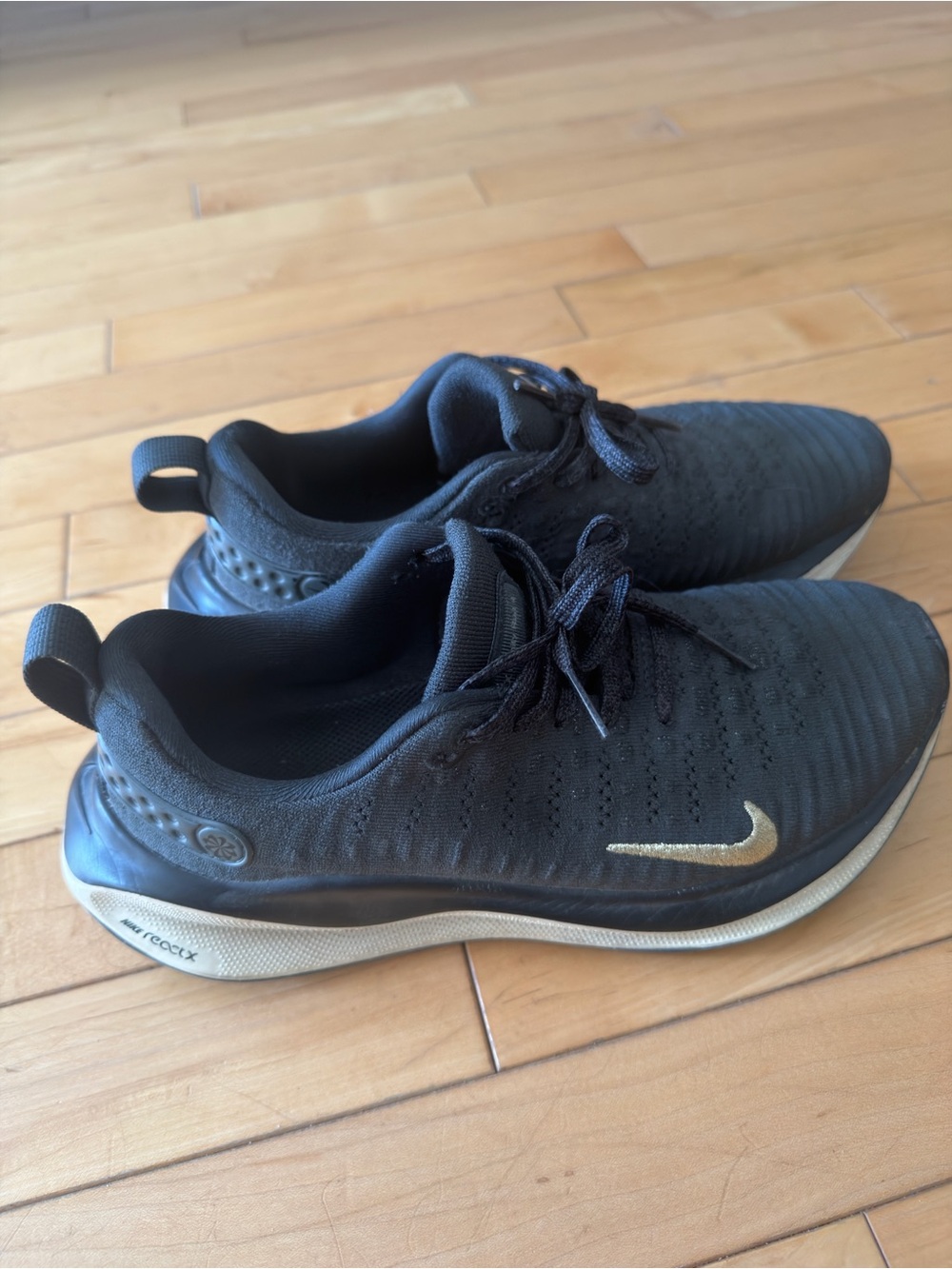 Nike Men’s Black Athletic Shoes with Gold Swoosh